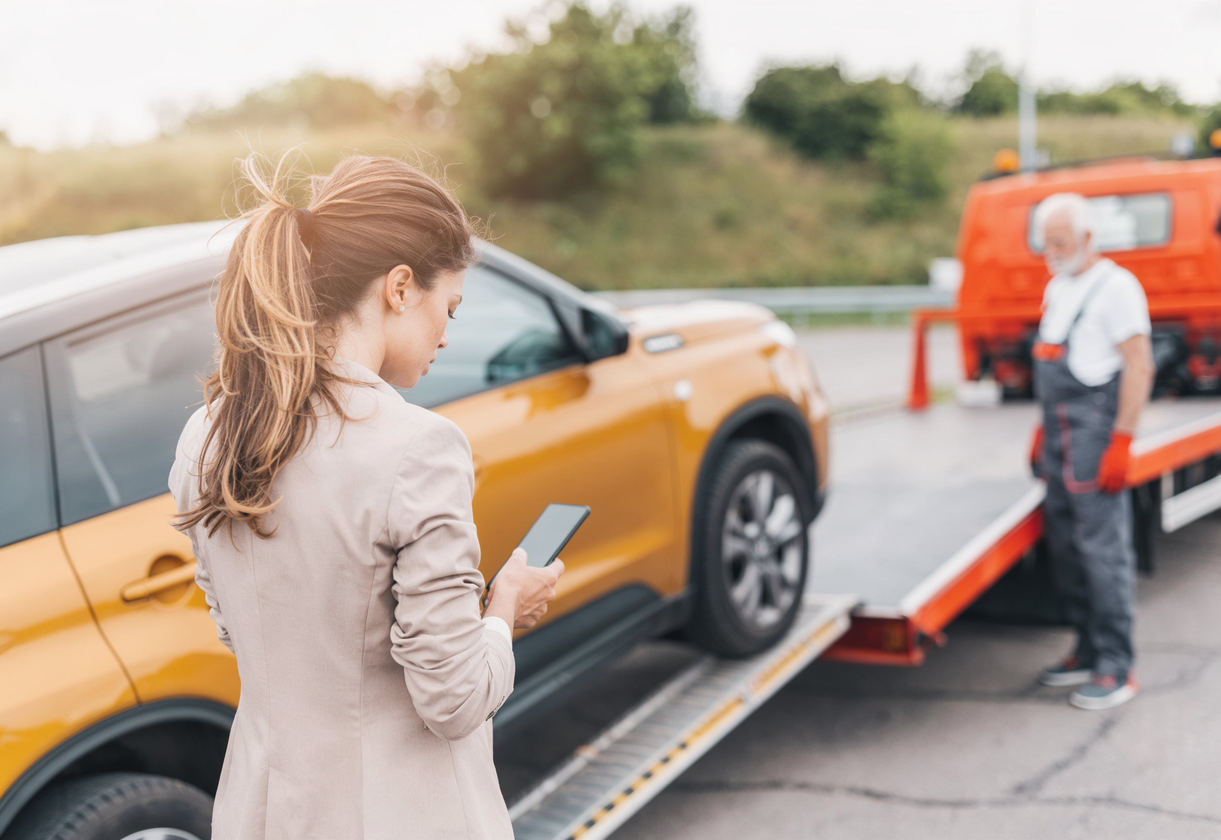 Car breakdown on highway waiting for emergency towing service